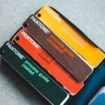 Top view of Pantone color guides showcasing vibrant shades for creative design projects.